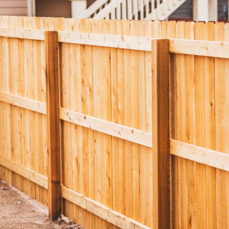 Cedar wood privacy fence next to a home in The Woodlands Texas