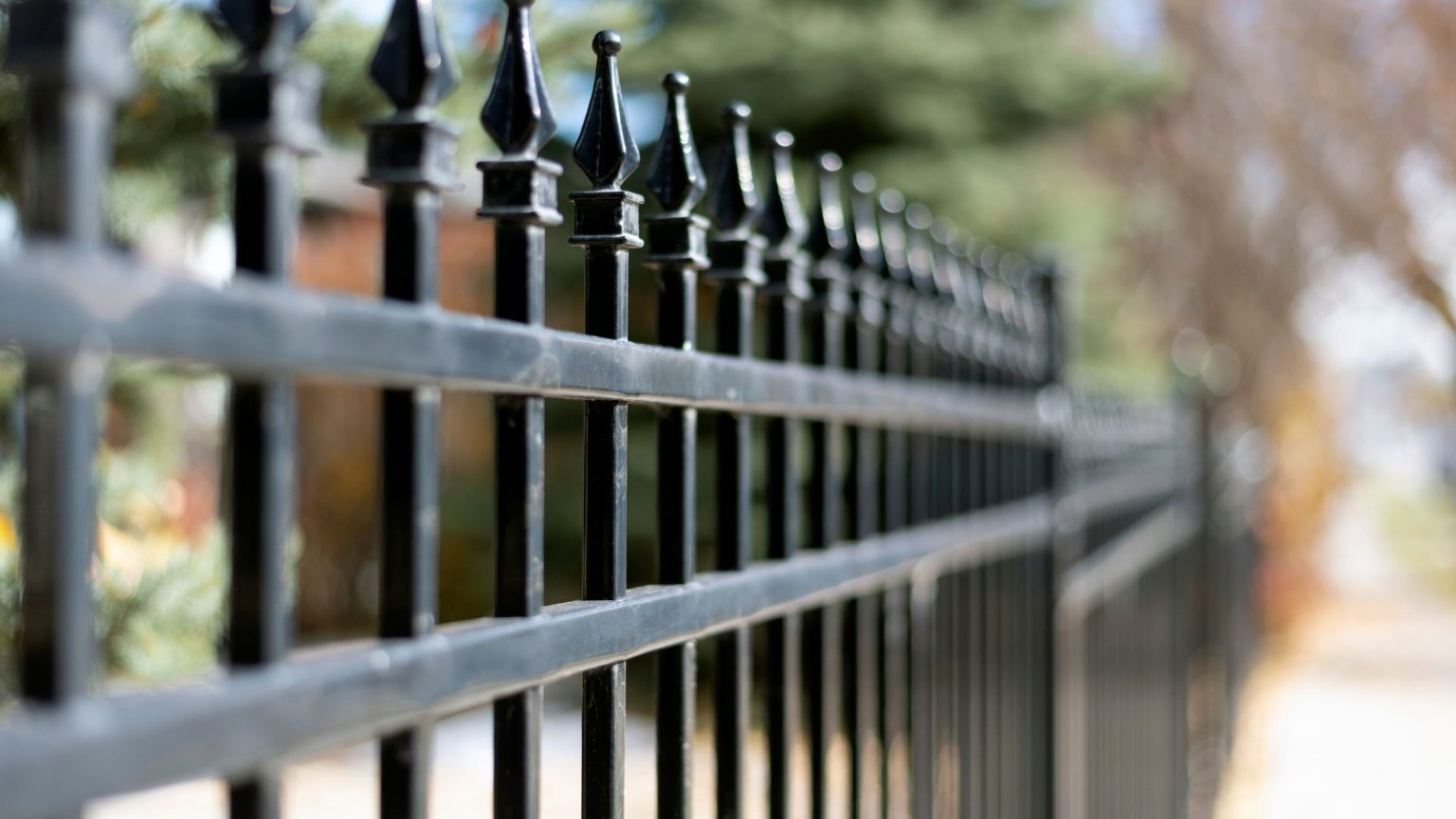 Black ornamental iron fence with spear top pickets in Conroe Texas